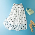 Jupe midi blanche à pois, coupe évasée