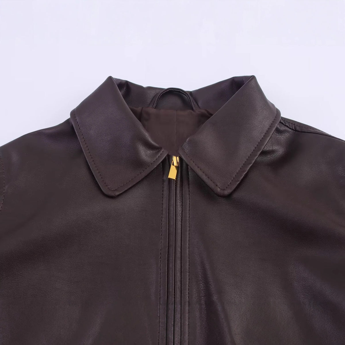Blouson femme marron enduit à poches et détails dorés