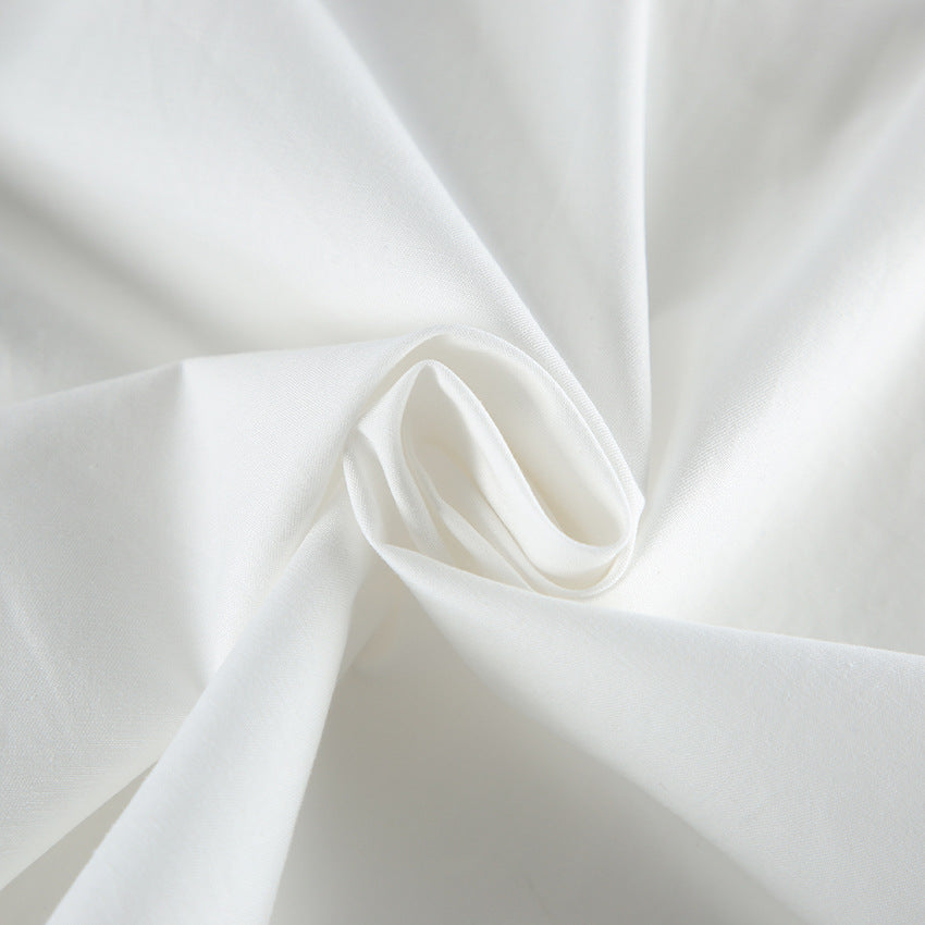 Blouse blanche en coton à grand nœud et manches bouffantes