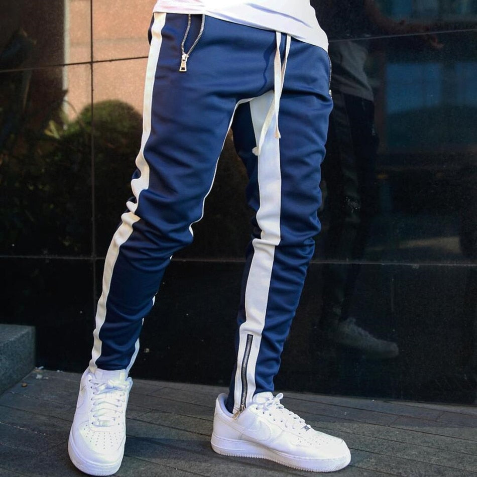 Jogging homme ajusté à bandes contrastantes et zips aux chevilles