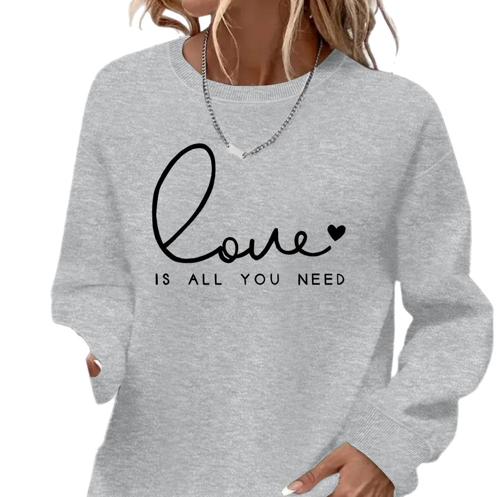 Sweat femme ample à col rond « Love is what you need »