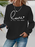 Sweat femme ample à col rond « Love is what you need »