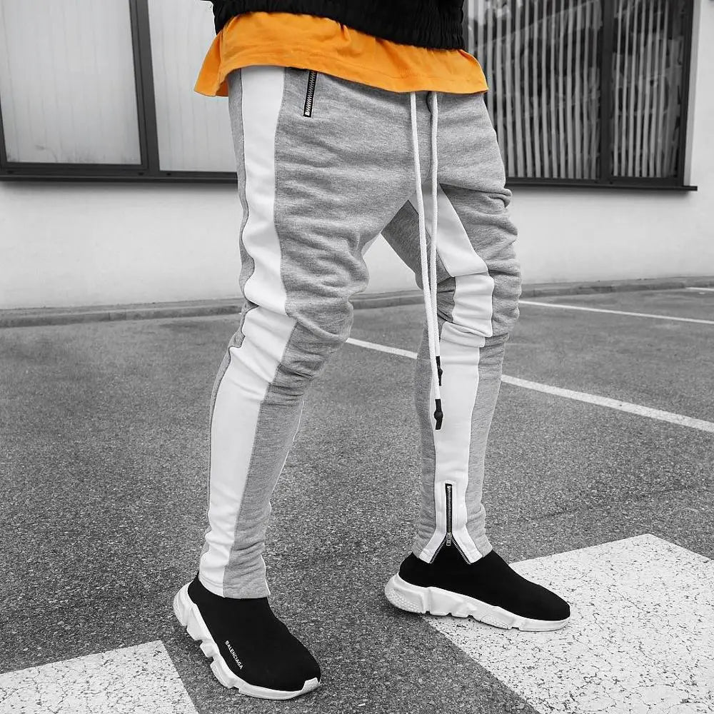 Jogging homme ajusté à bandes contrastantes et zips aux chevilles