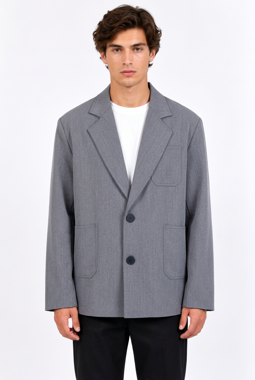 Jeff portant le blazer oversize gris